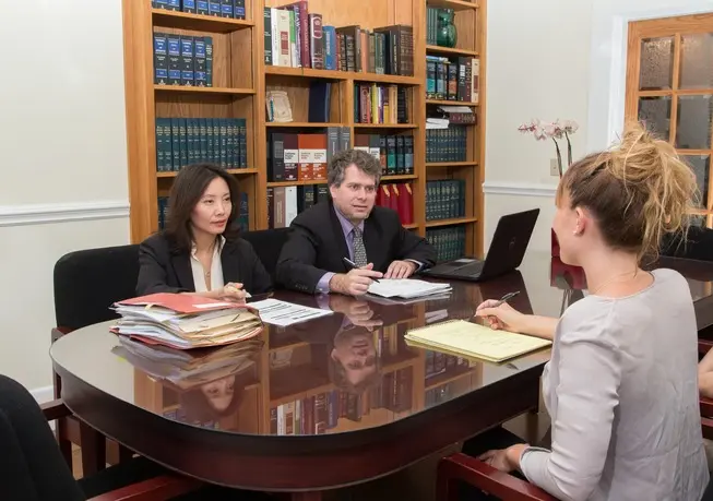 Lawyers in the office assisting a client
